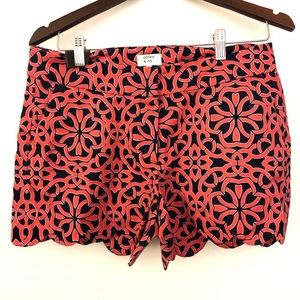 Navy and pink printed short shorts.